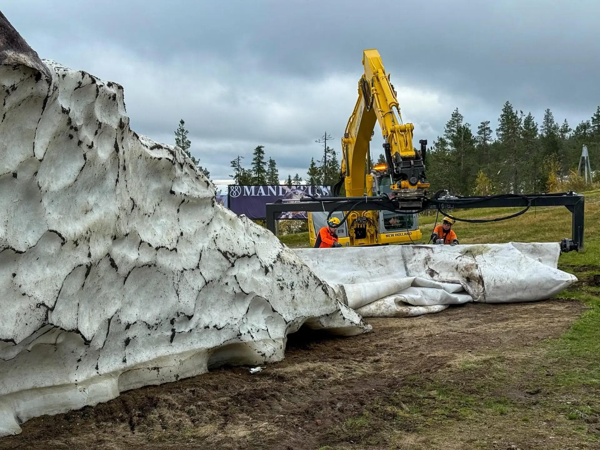 The resort teams start to uncover the snow they saved all summer