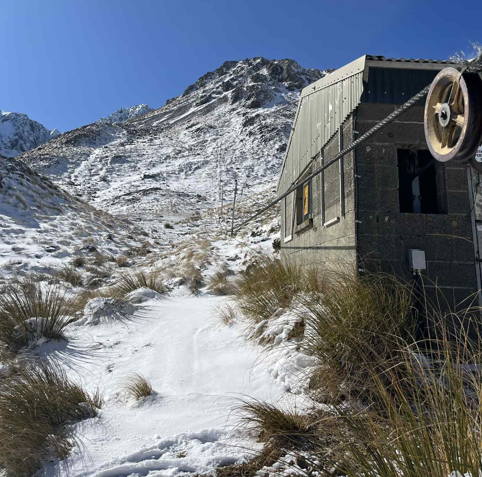A lift hut at the base of Temple Basin showing the lack of snow.