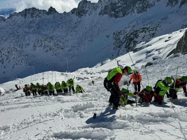 After a previous avalanche the workers are probing for survivors.