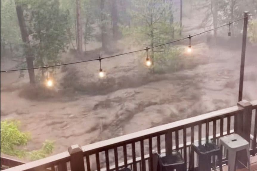 New Mexico flooding rescuers searching for three missing people after homes and vehicles swept away - body image 1