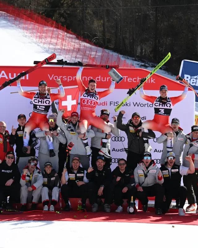 Swiss team celebrates an all Swiss podium at Garmisch-Partenkirchen.