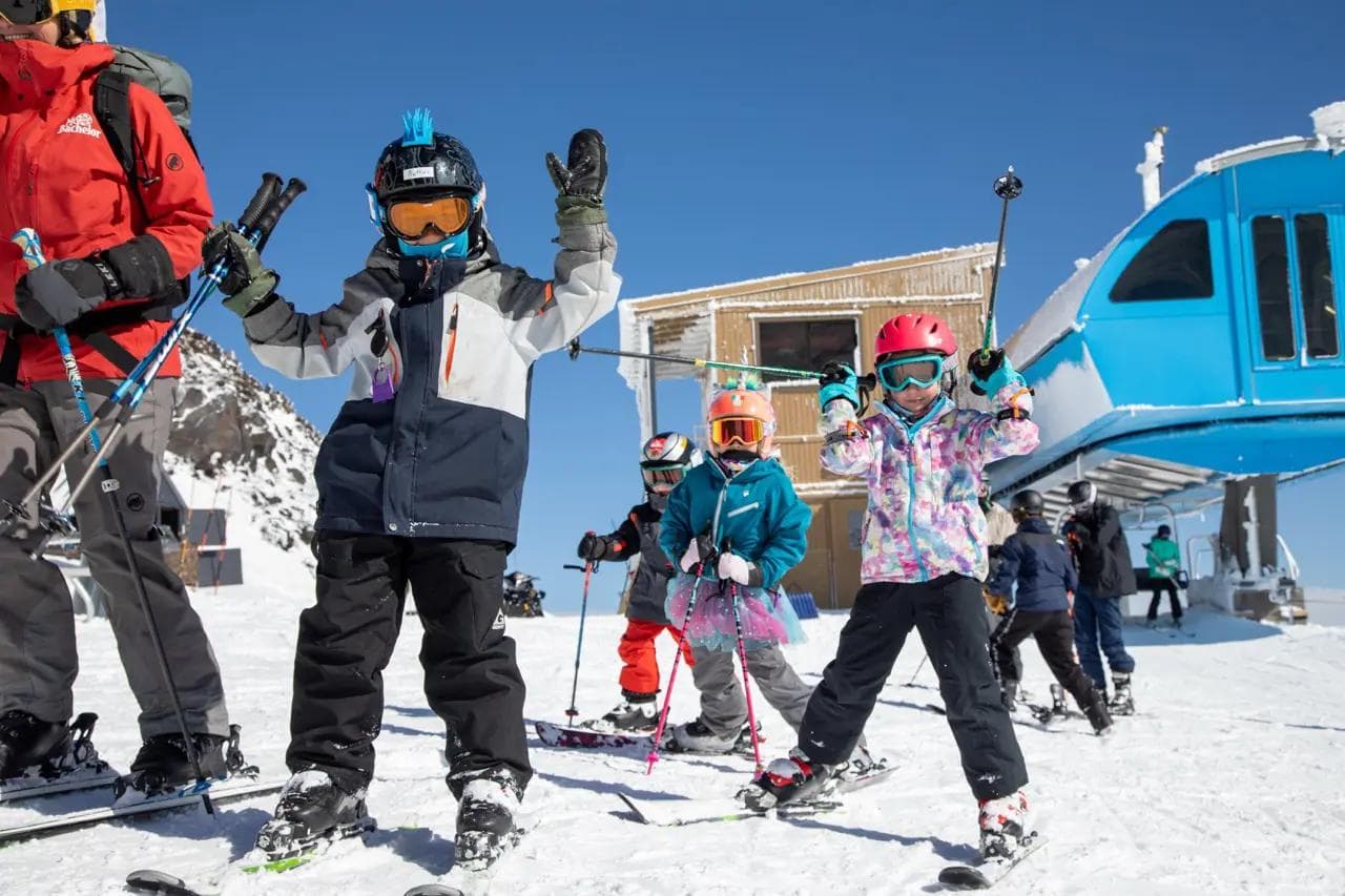 Kids enjoying a bluebird ski day