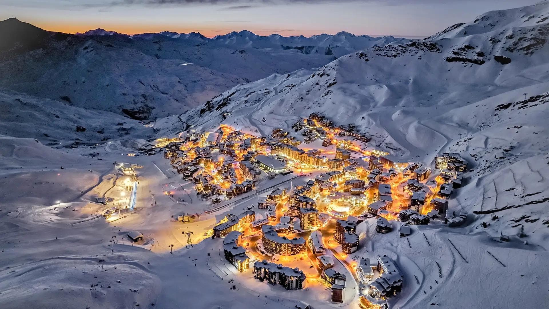 The Val Thorens village at night time.