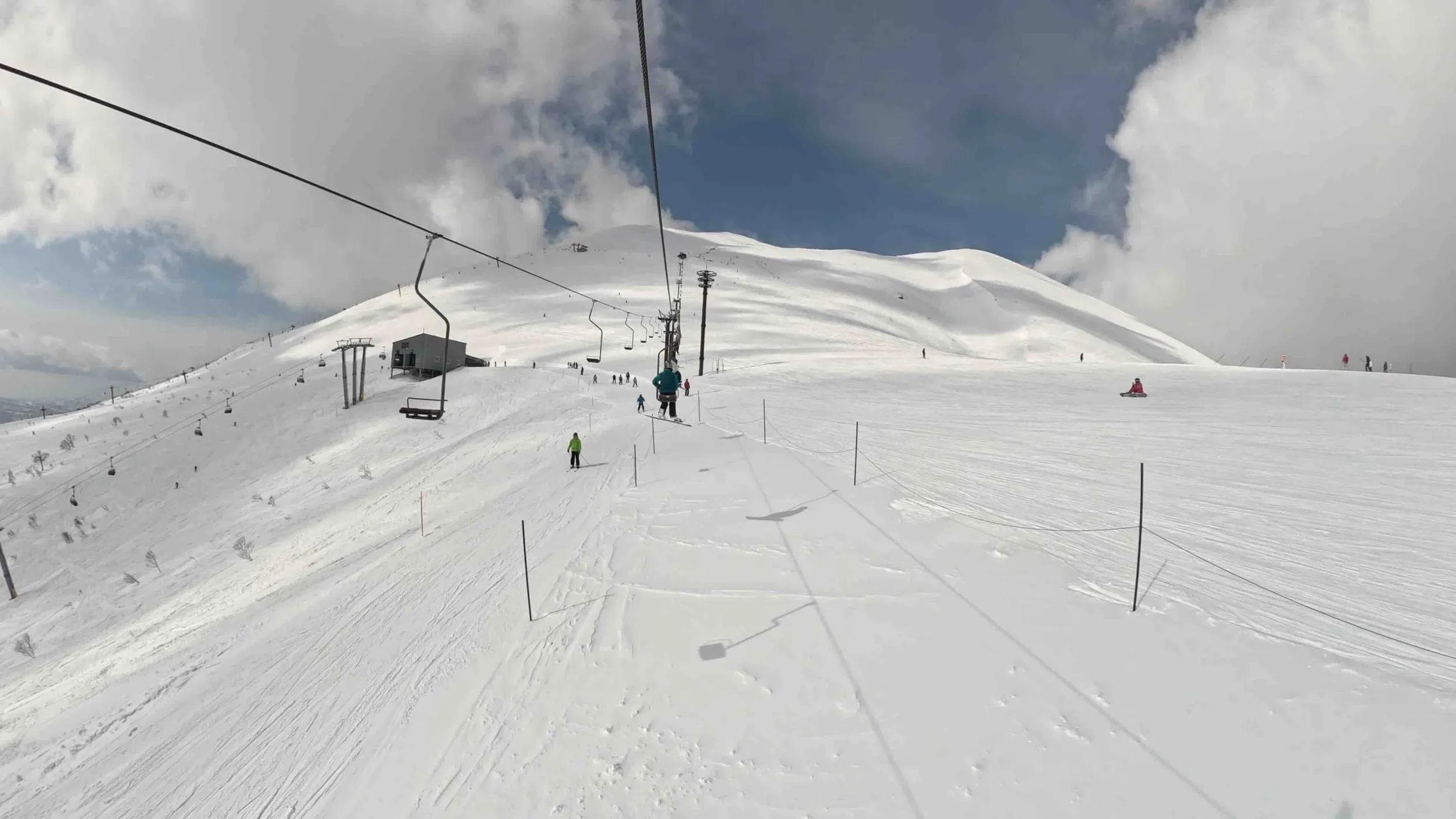 Riding the single chair to the summit of Niseko.