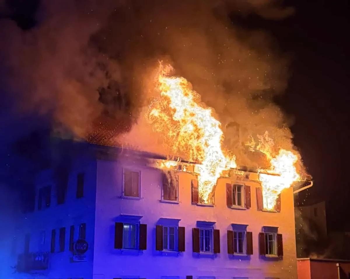 The fire raging in the upper sections of the restaurant and apartment building.