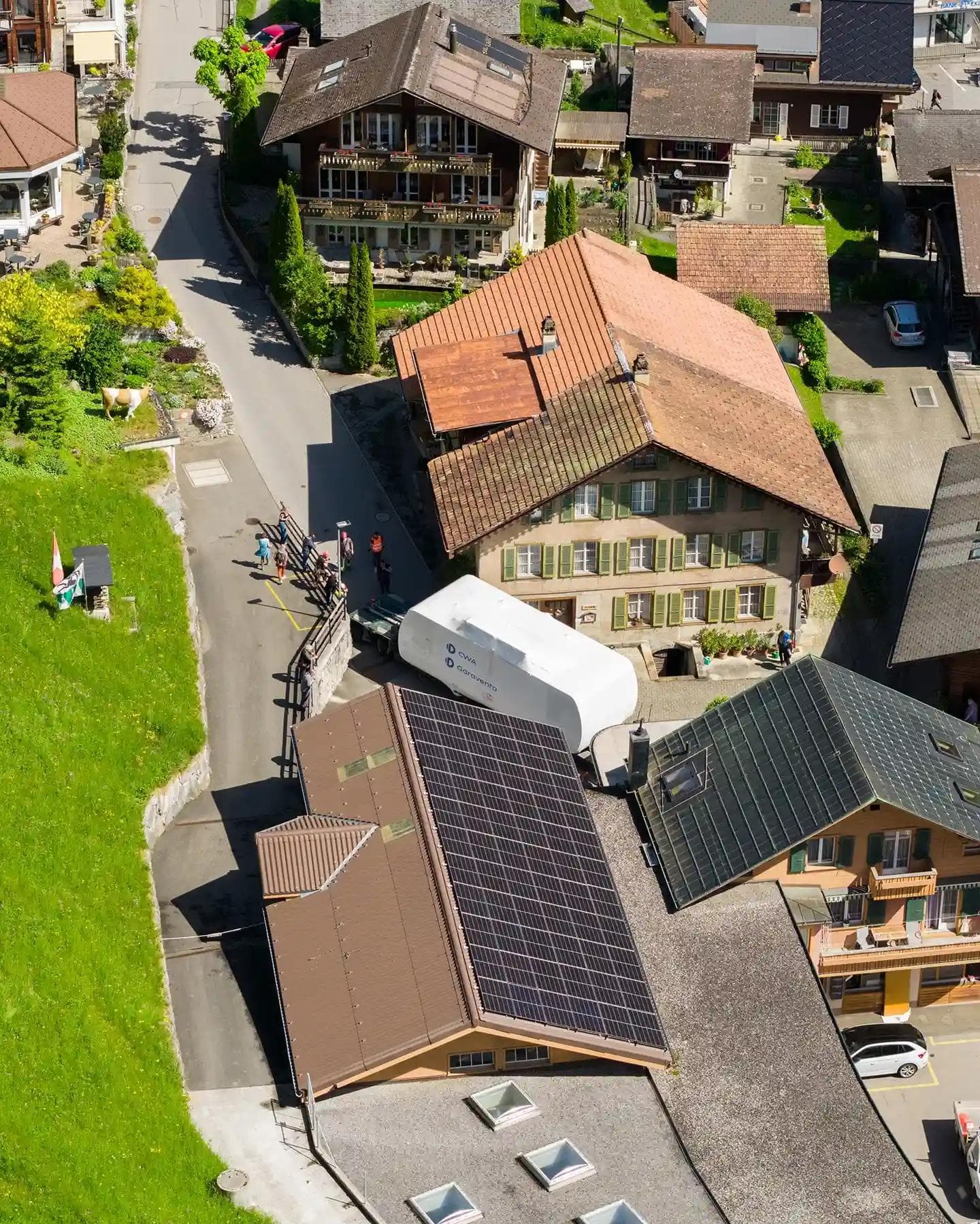 The new cabin being taking through the tight streets of Lauterbrunnen