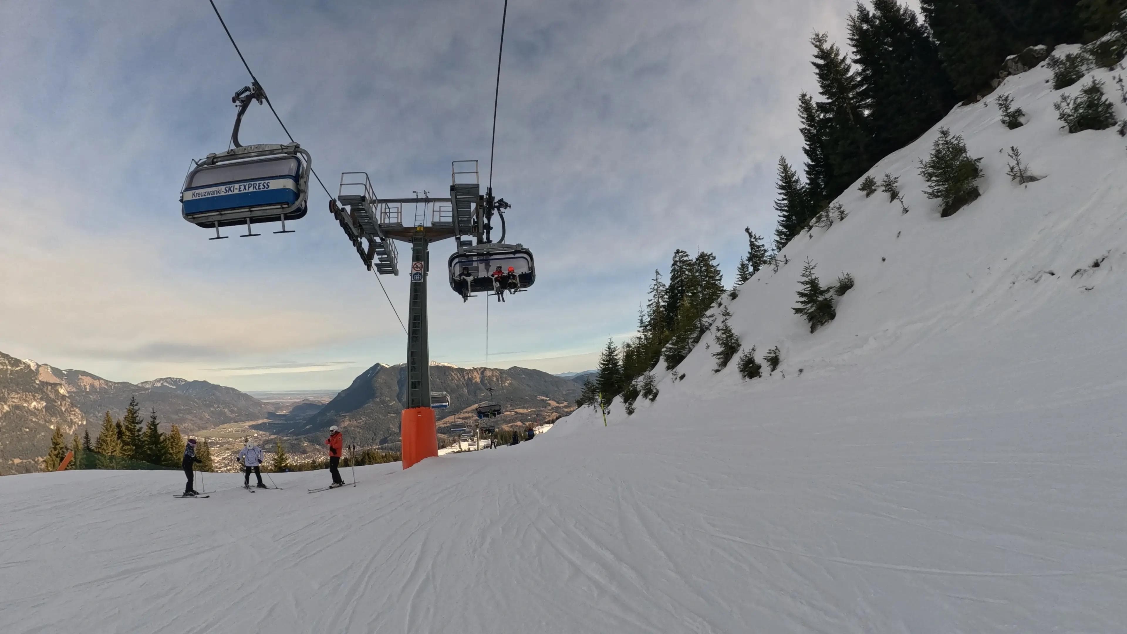 Riding under the lift line of the existing Kreuzwankl lift.
